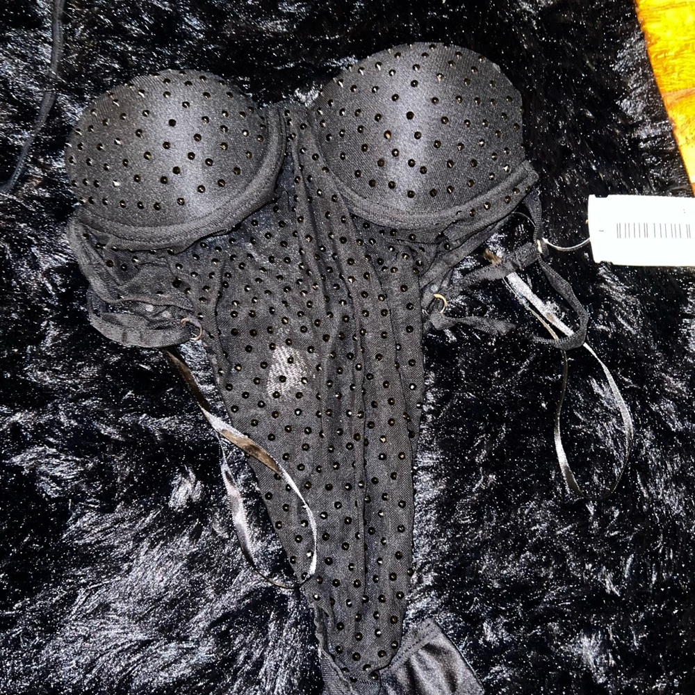 small black body suit with rhinestones.  built in cups.